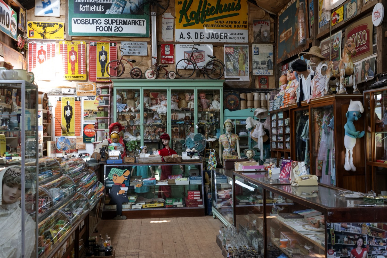 Inside a long-standing South African general dealer, its counters and shelves packed with goods.